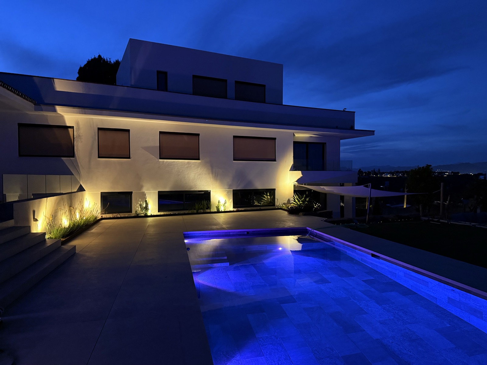 Casa Destino illuminated at night