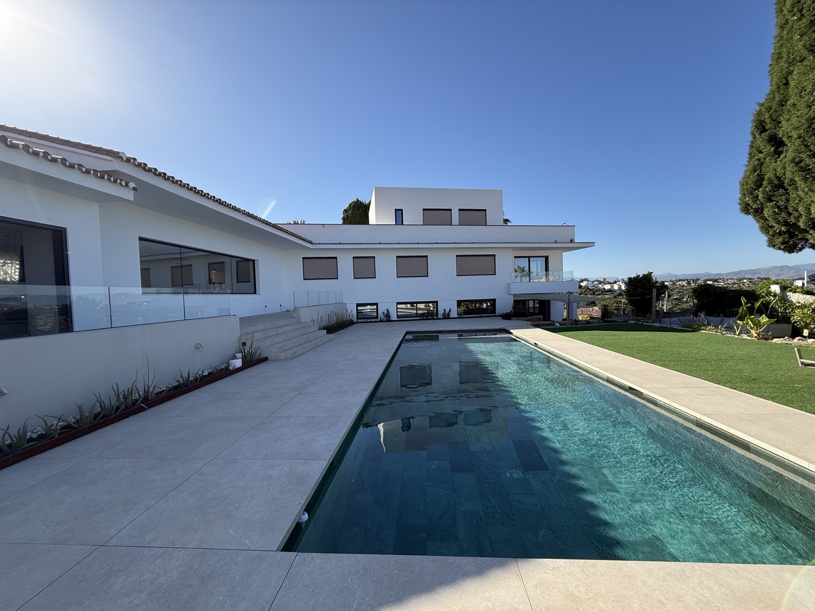 Pool with villa in the background